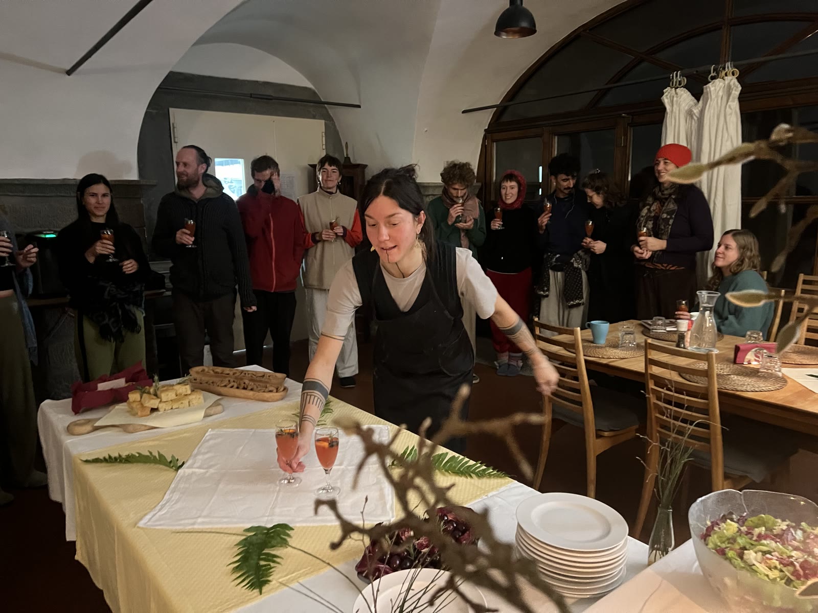 People gather around a festive New Year’s Eve table.